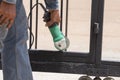 Worker using an angle grinder to grinding door frames Royalty Free Stock Photo