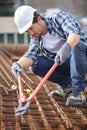 worker using bolt croppers on metal rebars Royalty Free Stock Photo