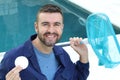 Worker using chlorine in swimming pool