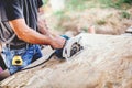 Worker Using Circular Saw on wooden board in Carpentry Workshop Royalty Free Stock Photo