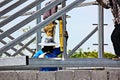 Worker using construction bubble level checking the steel structure in construction site while welded steel frame Royalty Free Stock Photo
