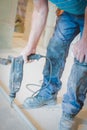 A worker using a drill to break cement floor surface Royalty Free Stock Photo