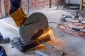 A worker using a fiber machine cutting steel sparks Royalty Free Stock Photo