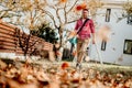 Worker using garden blower, working and cleaning up in the garden Royalty Free Stock Photo