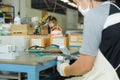 Worker using handy air belt sander