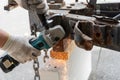 Worker using a metal grinder machine to cut off a piece of metal Royalty Free Stock Photo