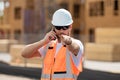 Worker using phone, builder taking on phone a break from work. Architect with mobile phone. Portrait worker man with Royalty Free Stock Photo