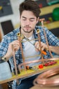 Worker using propane gas torch for soldering copper pipes Royalty Free Stock Photo