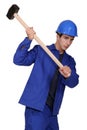 Worker using a sledge hammer Royalty Free Stock Photo