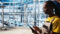Worker using tablet in smart factory, collecting and analyzing data Royalty Free Stock Photo