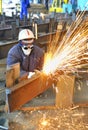 Worker using torch cutter to cut through metal Royalty Free Stock Photo