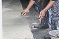 orker he is using trowel and leveling concrete Royalty Free Stock Photo