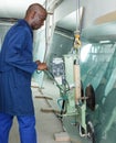 Worker using vacuum glass lifter Royalty Free Stock Photo