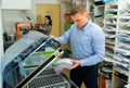 Worker using vacuum packing machine in printing shop Royalty Free Stock Photo