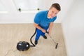 Worker Vacuuming Carpet