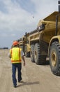 Worker Walking Near Trucks At Landfill Site Royalty Free Stock Photo