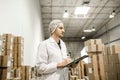 Worker In warehouse for food packaging. Royalty Free Stock Photo