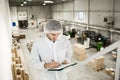 Worker In warehouse for food packaging. Royalty Free Stock Photo