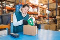 worker in warehouse preparing goods for dispatch Royalty Free Stock Photo