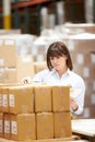 Worker In Warehouse Preparing Goods For Dispatch Royalty Free Stock Photo