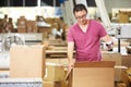 Worker In Warehouse Preparing Goods For Dispatch Royalty Free Stock Photo