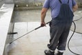 The worker washes the surface from rust Royalty Free Stock Photo