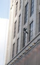 A worker is washing the building located in shanghai Royalty Free Stock Photo