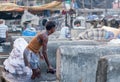 Worker washing clothes at Dhobi Ghat in Mumbai, India Royalty Free Stock Photo