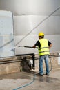 Worker washing industrial site Royalty Free Stock Photo