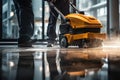 Worker washing office floor with cleaning machine