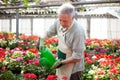 Worker watering plants