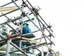 Worker wear safety belt work at hight on scaffolding Royalty Free Stock Photo