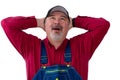 Worker wearing dungarees opening mouth