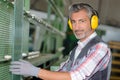 Worker wearing hearing protection at factory