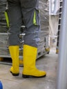 Worker wearing protective boots in a craft beer canning factory