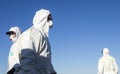 A worker wearing a protective gear unloads personal protection equipment from a plane Royalty Free Stock Photo