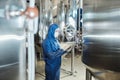 Worker wearing protective suit at industrial chemical factory workshop Royalty Free Stock Photo