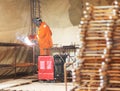 Worker weld metal gratings by acetylene torch Royalty Free Stock Photo