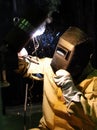Worker-welder manufactures metal