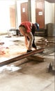 A worker in welding a iron sheet on a project. Royalty Free Stock Photo