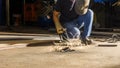 worker welding metal, focus on flash light line of sharp spark,in low light Royalty Free Stock Photo