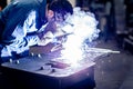Worker welding metal working in steel heavy industry manufacturing Royalty Free Stock Photo