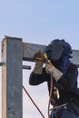 Worker welding parts of stell construction