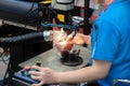 Worker welding repair mold and die part by Laser welding machine