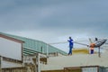 Worker welding the steel part for roof