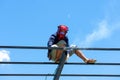 Worker welding the steel structure of roof with arc welding machine and blue sky in background Royalty Free Stock Photo