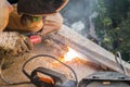 The worker welds the metal structure using the arc welder. Work of welding setup Royalty Free Stock Photo