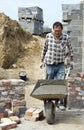 Worker with wheelbarrow