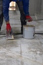The worker who applied the resistant epoxy resin in the new hall was highly skilled and experienced in the application of epoxy