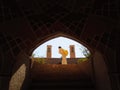 Worker by wind catching towers of Kashan palace Royalty Free Stock Photo